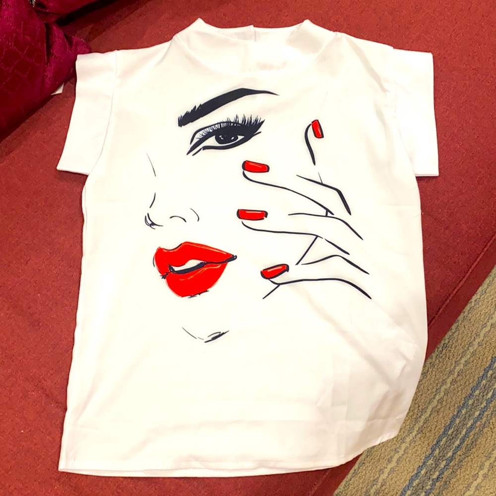 White top with woman in red detailing